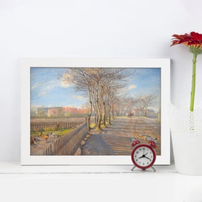Infidu Vintage Wall Art featuring a peaceful pathway through trees with a bright blue sky and lush background. Ideal for vintage wall decor. displayed on the wall in a white frame