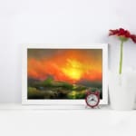 Infidu vintage ocean sunset wall art with fiery sky, waves, and glowing sun in bold colors of orange, red, yellow, and green. displayed on the wall