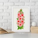 Vintage botanical wall art of pink flowers with red centers and green leaves on a soft off-white background. displayed on the wall