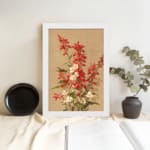 Vintage botanical wall art with red and white flowers and green leaves on a tan background. displayed on the wall