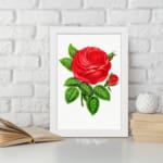 Vintage wall art of a bold red rose with green leaves on a white background, displayed on the wall