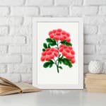 Infidu vintage wall art featuring delicate pink flowers and vibrant green leaves against a white background with a sleek black frame. displayed on the wall art in a black frame