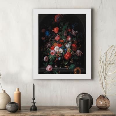 Vintage floral wall art with vibrant red, orange, pink, and white flowers against a dark background for an elegant and timeless design. hung on the wall in a white frame