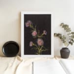 Vintage floral wall art with pink and purple flowers on black background by Infidu displayed on the wall