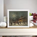 Vintage wall art of a snowy winter night with a horse-drawn sleigh, glowing lights, and people walking in front of a lit church. displayed on the wall