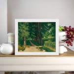 Vintage wall art of a forest path with tall green trees and earthy tones by Infidu. displayed on the wall