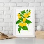 Vintage botanical art print of yellow raspberries on a green leafy branch with a white background from Infidu. displayed on the wall
