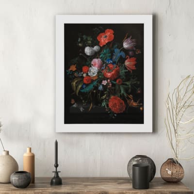 Vintage Floral Still Life Wall Art with Red and Blue Flowers against a dark background. hung on the wall in a white frame
