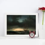 Vintage wall art of a sailing ship on a stormy sea with dark waves and a dramatic, cloudy sky. displayed on the wall