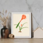 Infidu Elegant Orange Flower Vintage Wall Art featuring a vibrant orange flower with green leaves, framed in white. displayed on the wall