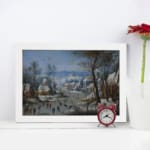 Vintage wall art showing a lively winter village scene with people skating, snowy houses, bare trees, and a soft blue sky. displayed on the wall