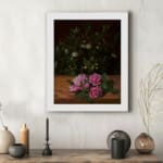 Infidu vintage wall art featuring delicate pink roses with lush green leaves on a rustic wooden background. displayed on the wall art in a white frame
