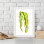 Vintage wall art of a single leaf with flowing, wavy shapes in green and yellow, framed in white on a white background. displayed on the wall