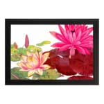 Vintage floral wall art featuring pink, red, and yellow lotus flowers with green leaves on a white background, framed in black. hung on the wall