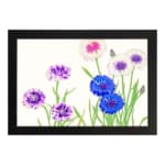Infidu Vintage Floral Wall Art with blue, purple, and white flowers, green stems, and a black frame on a light background. hung on the wall