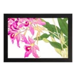 Vintage floral wall art with pink orchids, yellow centers, green leaves, and a black frame on a white background. hung on the wall