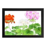 Infidu Vintage Floral Wall Art with orange, pink, and white flowers, green leaves, and a black frame on a white background. hung on the wall