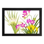 Infidu Vintage Floral Wall Art with pink, yellow & white flowers, green leaves, and a black frame on a white background. hung on the wall