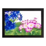 Infidu Vintage Floral Wall Art with deep blue and pink flowers, bright green leaves, a white background, and a black frame for a classic touch. hung on the wall