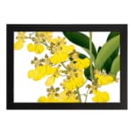 Vintage floral wall art with yellow flowers and green leaves in a black frame. hung on the wall