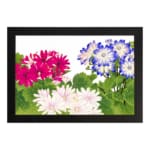 Vintage floral wall art with pink, white, and blue flowers surrounded by green leaves on a white background, framed in black for an elegant look. hung on the wall