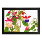 Infidu Vintage Floral Wall Art with pink, red, and purple flowers, green leaves, and a black frame on a white background. hung on the wall.