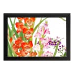 Vintage floral wall art with bright orange and soft pink flowers, green leaves, and a black frame on a white background. hung on the wall