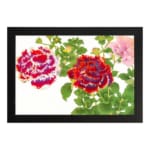 Infidu Vintage Floral Wall Art with red, purple, and pink flowers, green leaves, and a black frame on a white background. hung on the wall