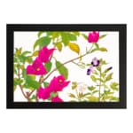Infidu vintage wall art with bright pink, purple, and white flowers, green leaves, and a black frame on a white background for a classic look. hung on the wall on a white background