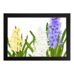 Infidu vintage wall art with yellow, white, and purple flowers, green leaves, and a black frame on a white background for a timeless botanical look. hung on the wall on a white background
