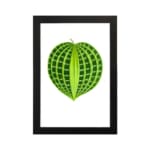 Heart-shaped green leaf with light and dark green patterns on white background, framed in black, vintage botanical wall art hung on the wall