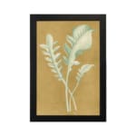 Vintage wall art of pale botanical fronds on an ochre background with a black frame. hung on the wall