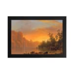 Vintage wall art of a tranquil sunset lake with warm tones, towering cliffs, and lush trees, creating a serene and timeless landscape. hung on the wall