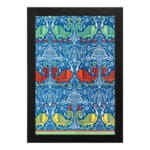 Vintage wall art with intricate decorative patterns in blue, red, green, and yellow, set against a blue background with a black frame. hung on the wall