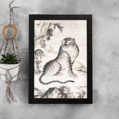 Vintage Asian tiger painting in black and white, featuring bold stripes, expressive eyes, and a natural background with trees and mountains. displayed on the wall