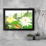 Vintage floral wall art with water lilies and green leaves, framed in black for a classic and elegant touch. displayed on the wall