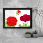 Infidu Vintage Floral Wall Art with red flowers, green leaves, and a black frame on a white background. displayed on the wall