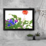 Vintage floral wall art featuring red, blue, and purple flowers with green leaves on a white background, framed in black for a classic look. displayed on the wall