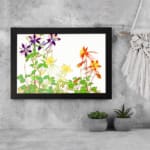Infidu Vintage Floral Wall Art with purple, yellow, and orange flowers, green leaves, and a black frame on a white background. displayed on the wall