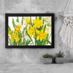 Infidu Vintage Floral Wall Art with bright orange flowers, dark green leaves, and a black frame on a white background. displayed on the wall