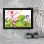 Vintage floral wall art with a pink water lily, purple flowers, and green leaves on a white background, framed in black for a classic look. displayed on the wall