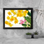 Infidu Vintage Floral Wall Art with yellow and pink flowers, green leaves, and a black frame on a white background. displayed on the wall