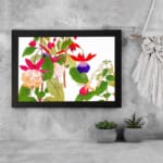 Infidu Vintage Floral Wall Art with pink, red, and purple flowers, green leaves, and a black frame on a white background. displayed on the wall
