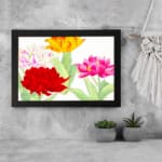 Infidu Vintage Floral Wall Art with red, pink, yellow, and white flowers, green leaves, and a black frame on a white background. displayed on the wall