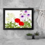 Vintage floral wall art with yellow, red, and purple flowers and green leaves on a white background. displayed on the wall