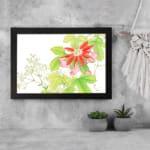 Infidu Vintage Floral Wall Art with a bright red flower, pink buds, green leaves, and small white flowers on a white background with a black frame. displayed on the wall