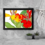 Vintage floral wall art with bright yellow and red flowers, green leaves, and a white background in a classic design. displayed on the wall