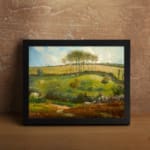 Vintage wall art showing a detailed gathering of people in a classic studio with warm colors, art pieces, and traditional decor. displayed on the wall in a black frame