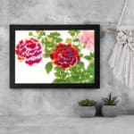 Infidu Vintage Floral Wall Art with red, purple, and pink flowers, green leaves, and a black frame on a white background. displayed on the wall