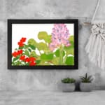 Infidu vintage wall art with soft pink and bright red flowers surrounded by lush green leaves on a white background, creating an elegant look. displayed on the wall art in a black frame